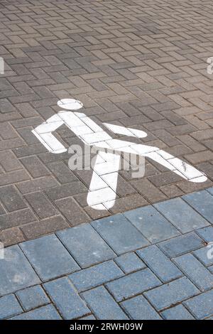 Symbole du sentier sur le trottoir en gros plan Banque D'Images