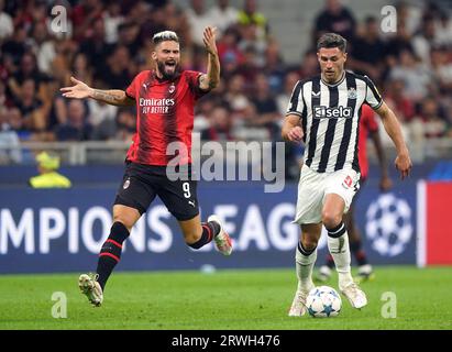 Olivier Giroud de l'AC Milan et Fabian Schar de Newcastle United en action lors du match du groupe F de l'UEFA Champions League à San Siro, Milan. Date de la photo : mardi 19 septembre 2023. Banque D'Images