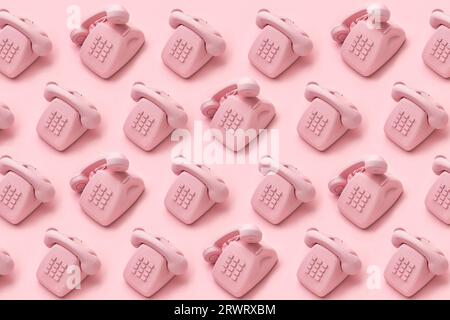 Motif de téléphone à cadran rotatif vintage sur fond rose. Concept créatif, centre d'appels, support client. . Photo de haute qualité Banque D'Images