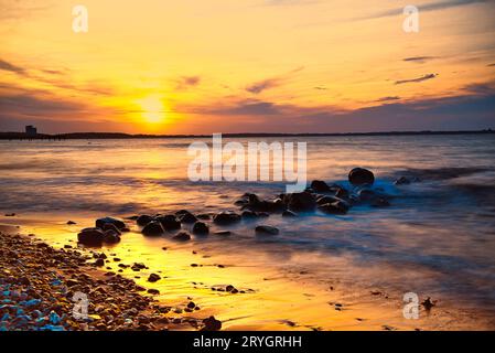 Coucher de soleil sur la plage de Niendorf Banque D'Images