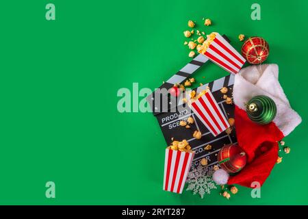 Partie de nuit de film de Noël, rassemblez des amis et la famille pour le home cinéma. Invitations au nouvel an, première du film de Noël avec clapperboard, Noël Banque D'Images