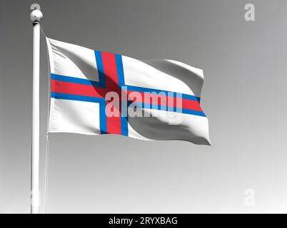 Drapeau national des îles Féroé isolé ondulant sur fond gris Banque D'Images