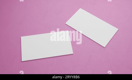 Maquette de carte de visite blanche empilant sur fond de table de couleur rose. Concept d'arrière-plan d'objet pour le modèle de présentation de marque pr Banque D'Images