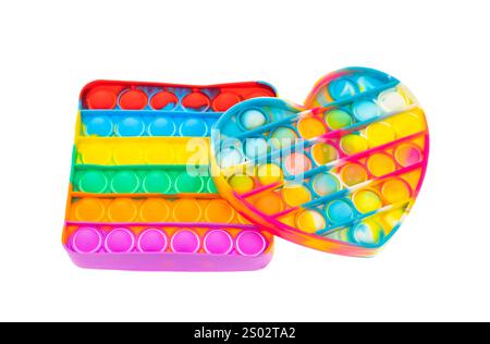 Pastel Color Sensory POP it jouet antistress pour enfants. jouet en silicone arc-en-ciel isolé sur blanc Banque D'Images