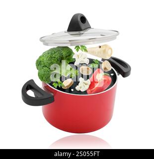 Légumes pour soupe et pot dans l'air sur fond blanc Banque D'Images