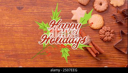Image de texte de joyeuses fêtes avec des feuilles sur cannelle, des biscuits et du lait sur une table en bois Banque D'Images