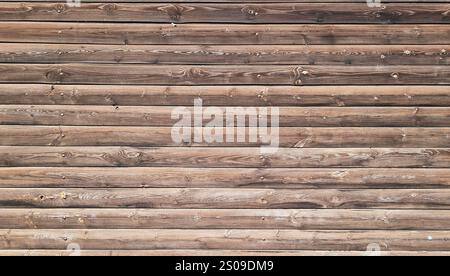 Vieux fond de clôture en bois, en gros plan. Fragment de clôture de fond de mur en bois vieilli. Gros plan Banque D'Images