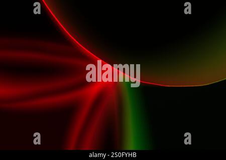 Lignes lumineuses vertes et rouges sur un fond noir faisant une image abstraite Banque D'Images