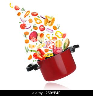 Légumes pour soupe et pot dans l'air sur fond blanc Banque D'Images