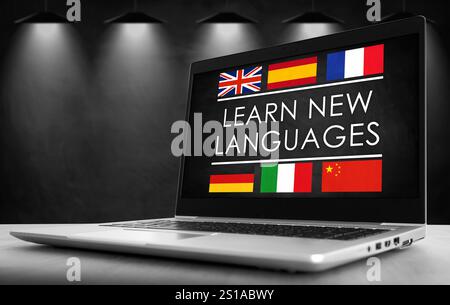 Apprendre de nouvelles langues - slogan écrit sur ordinateur portable Banque D'Images