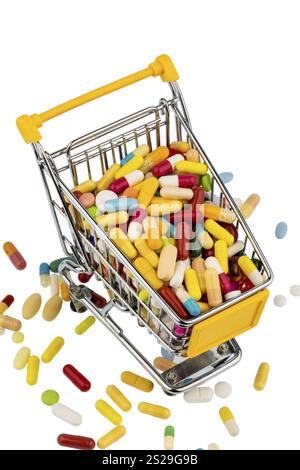 Comprimés colorés dans le chariot, photo symbolique pour les frais de santé, pharmacies, abondance de médicaments Autriche Banque D'Images