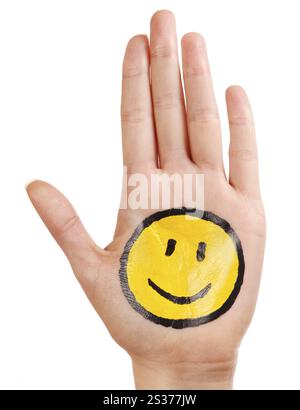 Palm avec un sourire heureux icône smiley peint sur elle isolé sur fond blanc Banque D'Images