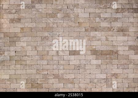 Texture de fond de mur de briques jaunes anciennes avec de la vieille maçonnerie en gros plan. Texture de fond de mur de briques jaunes anciennes avec de la vieille maçonnerie Banque D'Images