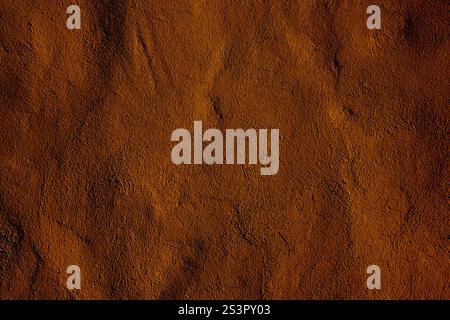 Gros plan d'une surface texturée brune montrant des motifs naturels complexes, offrant une texture terreuse qui respire la chaleur et l'esthétique naturelle, faisant Banque D'Images