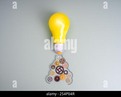 Démarrage d'entreprise, idée créative, inspiration, connaissance de l'éducation et de l'apprentissage, concept d'innovation. Ampoule jaune comme une fusée, lancer avec de nombreux rouages Banque D'Images