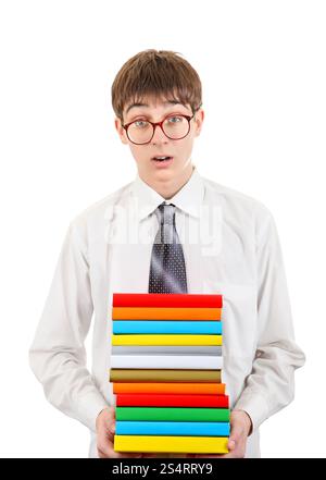 Étudiant surpris tenant pile des livres isolé sur le fond blanc Banque D'Images