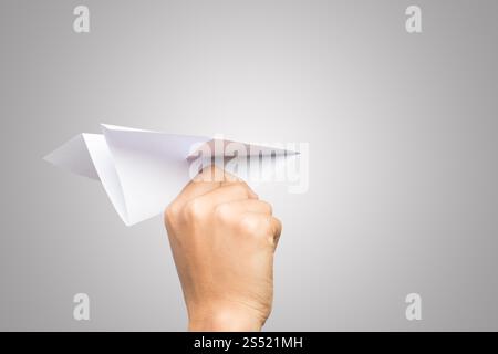 Avion de Papier Dart main femme isolé sur fond blanc. Banque D'Images