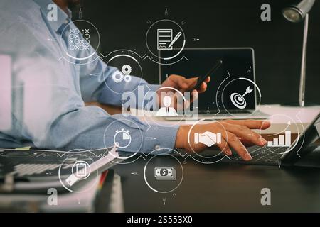 Gestion des processus d'affaires avec diagramme d'automatisation de flux de travail et engrenages dans diagramme de flux virtuel.homme d'affaires travaillant avec un téléphone intelligent et une tablette numérique Banque D'Images