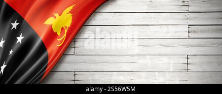 Drapeau de Papouasie-Nouvelle-Guinée sur vieux mur blanc. Bannière panoramique horizontale. Drapeau de Papouasie-Nouvelle-Guinée sur une vieille bannière murale blanche Banque D'Images