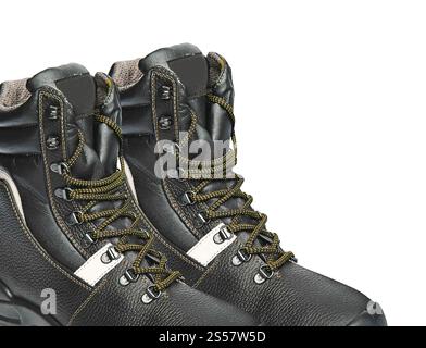 Les bottes hautes en cuir noir isolées sur fond blanc. Les bottes hautes en cuir noir isolées Banque D'Images