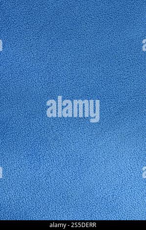 La couverture de tissu polaire bleu fourrure. Une texture de fond de tissu polaire doux bleu clair Banque D'Images