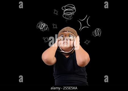 Le garçon prétend être un super-héros et utilise son esprit.Dessiner concept. Banque D'Images