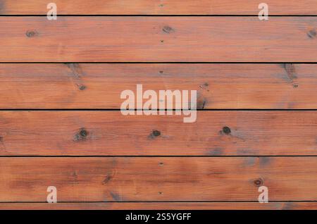 Fond en bois verni de l'extérieur de la cabine. Fond de surface de grain rugueux de planche de grange en bois brun. Fond en bois verni de l'extérieur de la cabine. Banque D'Images