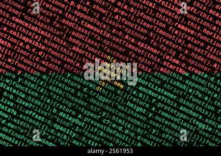 Le drapeau du Burkina Faso est représenté sur l'écran avec le code du programme. Le concept de technologie moderne et de développement de site. Le drapeau du Burkina Faso est Banque D'Images