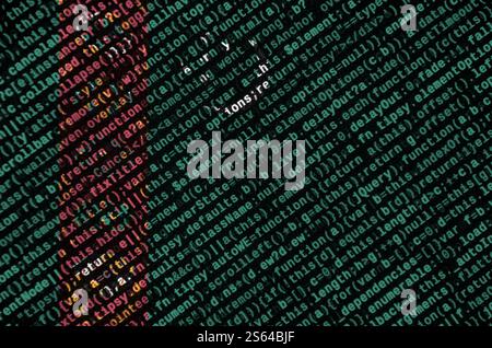 Le drapeau du Turkménistan est représenté sur l'écran avec le code du programme. Le concept de technologie moderne et de développement de site. Le drapeau du Turkménistan est Banque D'Images