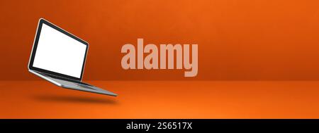 Ordinateur portable vierge flottant sur un fond orange. Illustration isolée 3D. Modèle de bannière horizontale. Ordinateur portable flottant isolé sur Banque D'Images