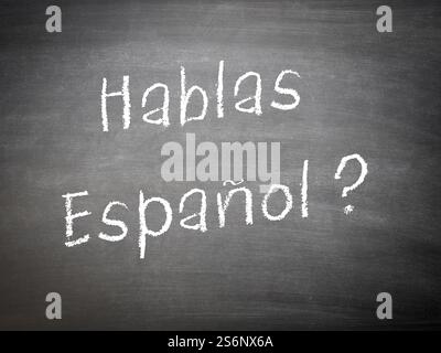Concept d'apprentissage de langue espagnol sur un tableau avec les mots Hablas Espanol ? Banque D'Images