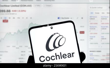 Cochlear logo is displayed on smartphone. Cochlear is a leading medical device company specializing in hearing solutions Banque D'Images