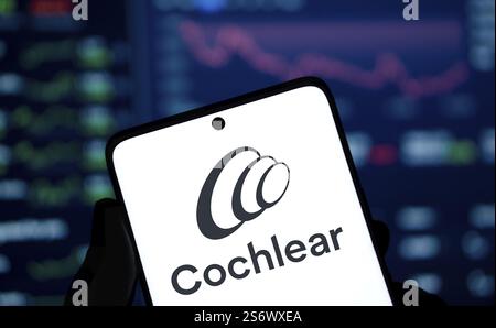 Cochlear logo is displayed on smartphone. Cochlear is a leading medical device company specializing in hearing solutions Banque D'Images