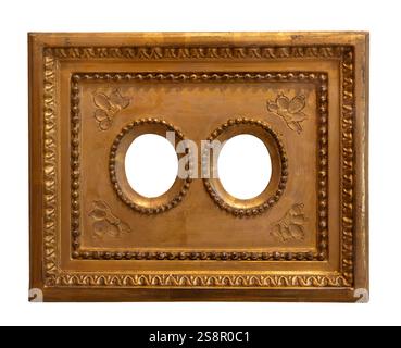 Un cadre doré avec des détails floraux et des découpes circulaires dans un design vintage classique avec des motifs complexes Banque D'Images