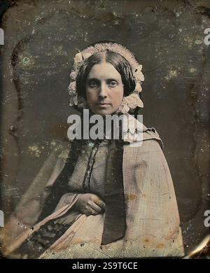 Une femme portant un bonnet est représentée dans un portrait des années 1850. Banque D'Images