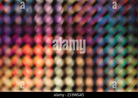 Spectre abstrait, motif envoûtant de lumières floues et colorées disposées dans une structure en forme de grille. Banque D'Images