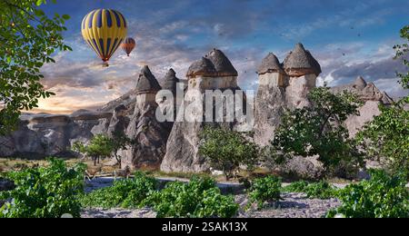 Montgolfières volant les touristes au-dessus des spectaculaires formations rocheuses mondialement célèbres et des églises rocheuses de la vallée de Pasaba au lever du soleil, Cappadoce, Turquie. Banque D'Images