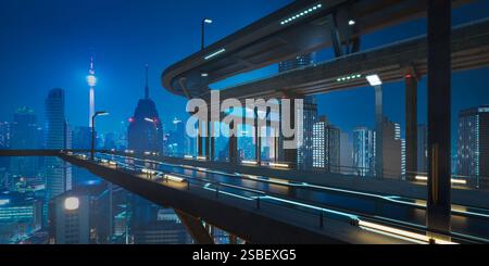 Pont autoroutier futuriste avec des lumières brillantes illuminant la ville moderne la nuit, mettant en valeur les infrastructures de transport avancées Banque D'Images