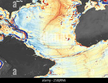 Une carte du fond marin créée à l'aide des données du champ de gravité. Les nuances d'orange et de rouge représentent les zones où la gravité du fond marin est plus forte (en milligals) que la moyenne mondiale, un phénomène qui coïncide principalement avec l'emplacement des crêtes sous-marines, des monts sous-marins et des bords des‚Äôs plaques tectoniques terrestres. Les nuances de bleu représentent les zones de gravité inférieure, correspondant en grande partie aux creux les plus profonds de l'océan. Banque D'Images