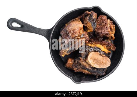 De courtes côtes de bœuf tendres dans une poêle, assaisonnées d'herbes et d'épices. Parfait pour les blogs culinaires ou les menus de restaurant qui se concentrent sur la viande copieux et savoureux d Banque D'Images