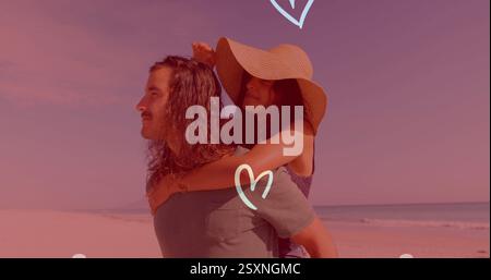 Image de coeur sur l'homme donnant femme piggyback tour sur la plage Banque D'Images