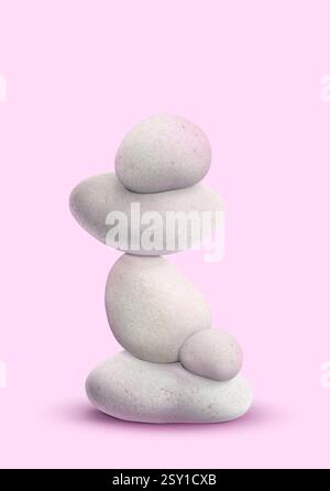 Équilibre montré sous forme de pierres empilées sur fond rose Banque D'Images