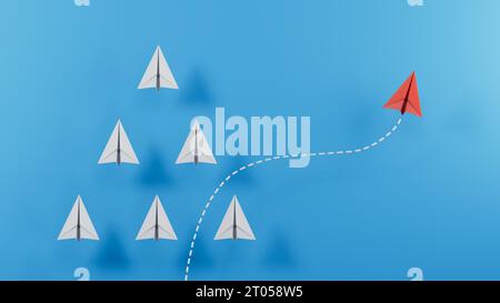 Pensez différemment concept. Plan papier rouge changeant de direction.rendu 3D sur fond bleu. Banque D'Images