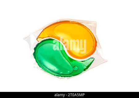 capsule de lavage ronde avec gel vert et jaune. Photo de haute qualité Banque D'Images