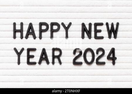 Lettre de couleur noire en mot Happy New Year 2023 sur fond de tableau de feutre blanc Banque D'Images