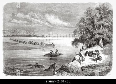 Amérindiens traversant le fleuve Colorado. ÉTATS-UNIS. Voyage de Heinrich Balduin Mollhausen du fleuve Mississippi aux rives de l'océan Pacifique 1853-1854. Gravure ancienne du 19e siècle du Tour du monde 1860 Banque D'Images