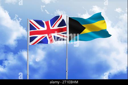 Drapeaux du Royaume-Uni et des Bahamas ensemble agitant contre le ciel bleu Banque D'Images