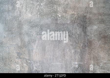 Prise de vue en grand angle d'un sol en béton gris altéré. Banque D'Images