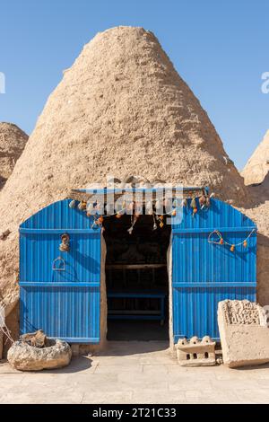 Une ruche ou maison tombale est un bâtiment fait d'un cercle de pierres et de boue surmonté d'un toit en dôme. Le nom vient de la similitude de forme avec A. Banque D'Images