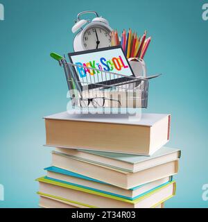 Panier avec des fournitures scolaires sur une pile de livres : retour à l'école shopping Banque D'Images